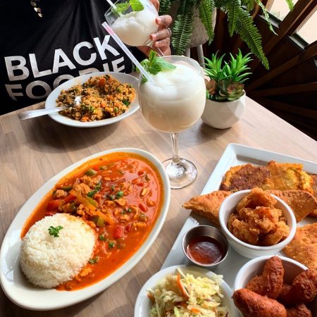 Picture of Haitian spread includes some classics (Fritay) and fusion items like: Pikliz: a spicy pickled mix of cabbage, carrots and onions